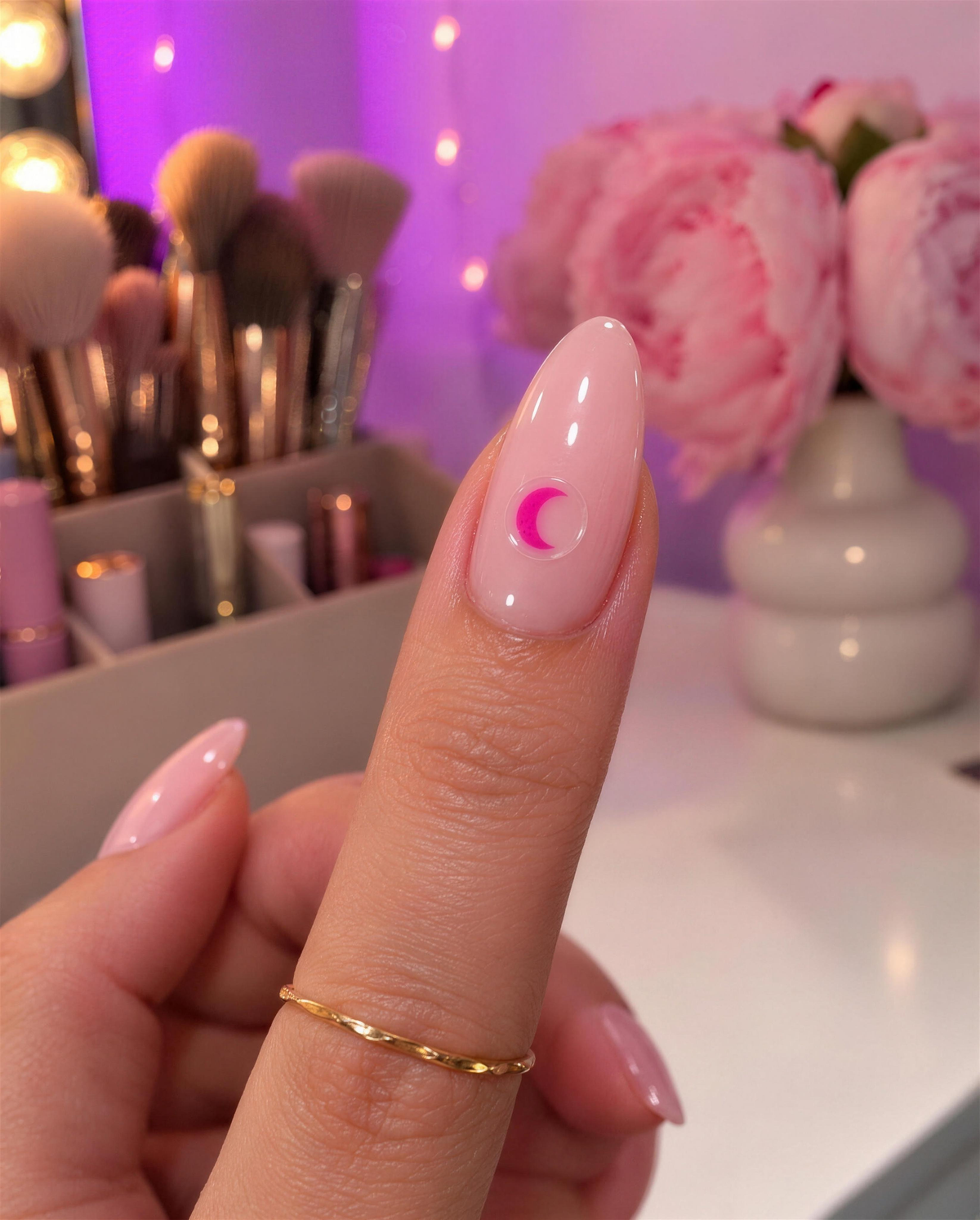 Crescent moon drink test sticker on an almond nail